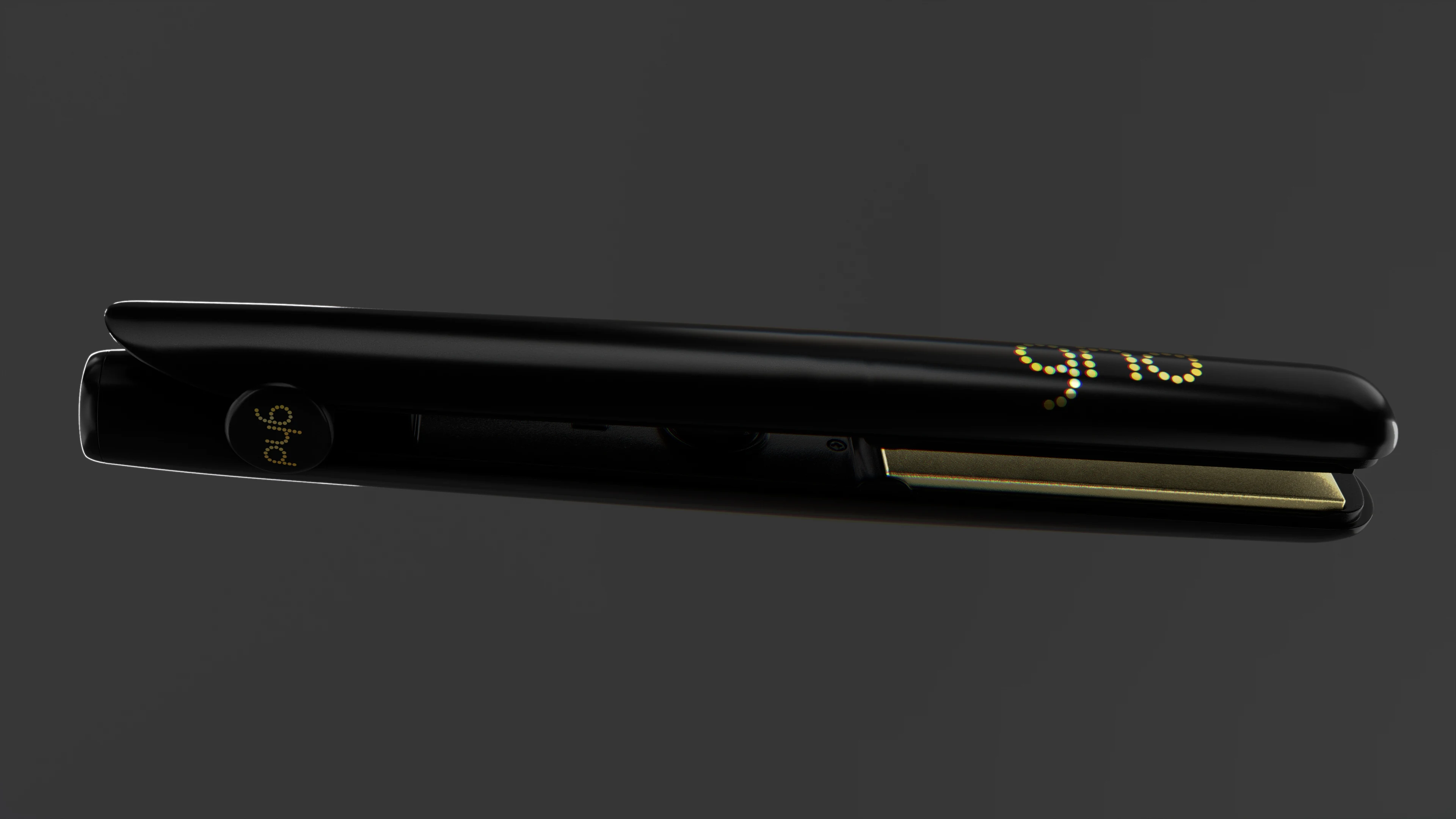 Side view of the black ghd Gold straightener, showing its gold trim and logo.
