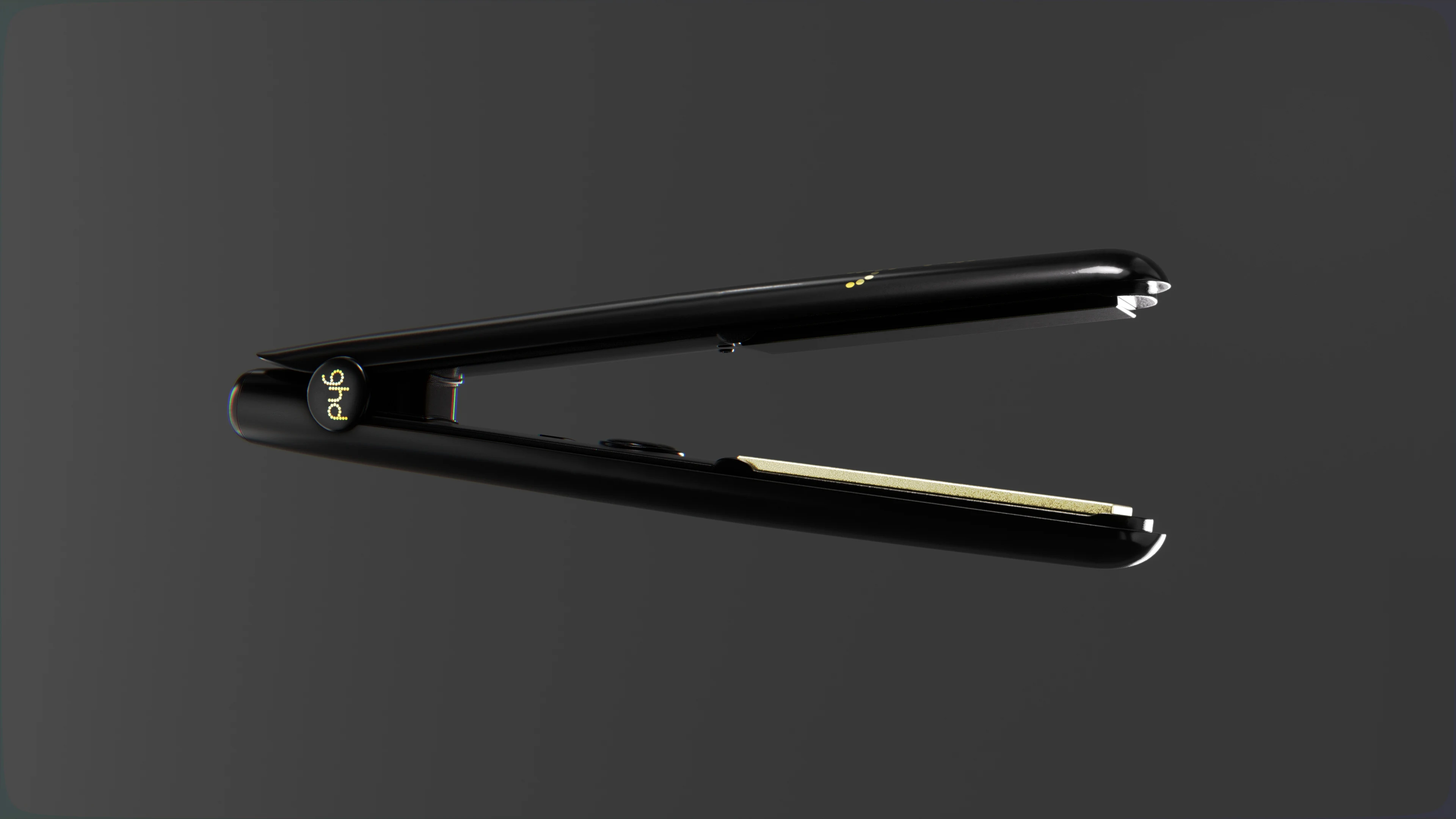 Black ghd Gold hair straightener open, with gold plates visible in a 3D product render.